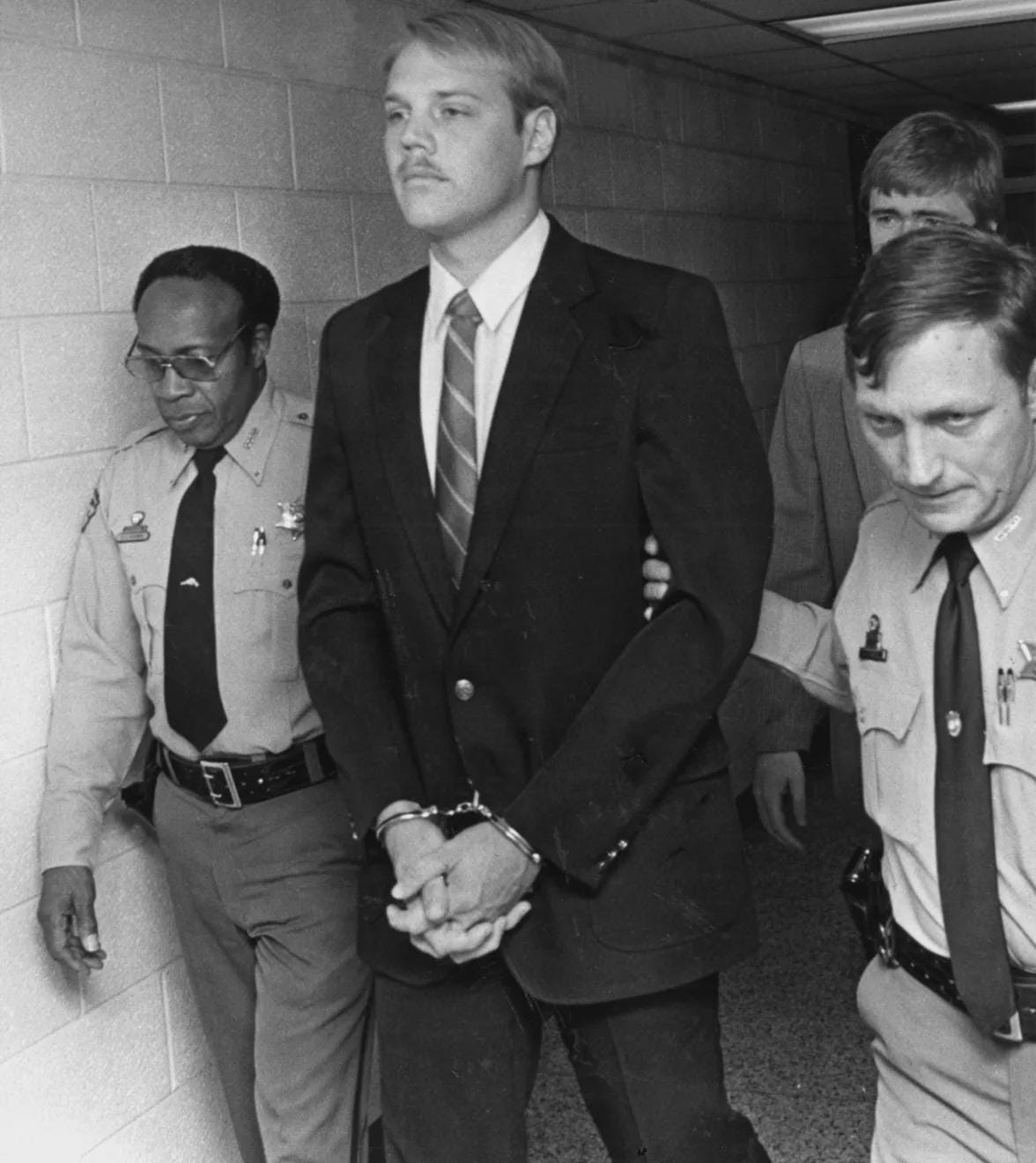 U.S. Army Sergeant Timothy Hennis appears in court on charges of raping and murdering a woman, and killing two of her young children present. He was sentenced to death, but acquitted at a retrial. Nearly 20 years later, DNA evidence confirmed his guilt, North Carolina, 1985. U.S. Army Sergeant Timothy Hennis appears in court on charges of raping and murdering a woman, and killing two of her young children present. He was sentenced to death, but acquitted at a retrial. Nearly 20 years later, DNA evidence confirmed his guilt, North Carolina, 1985.
