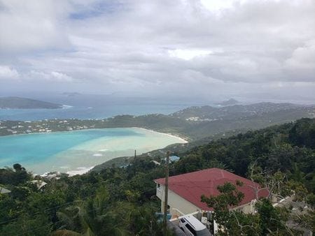 a view of Megan's bay beach after a storm with the water all churned up with sand