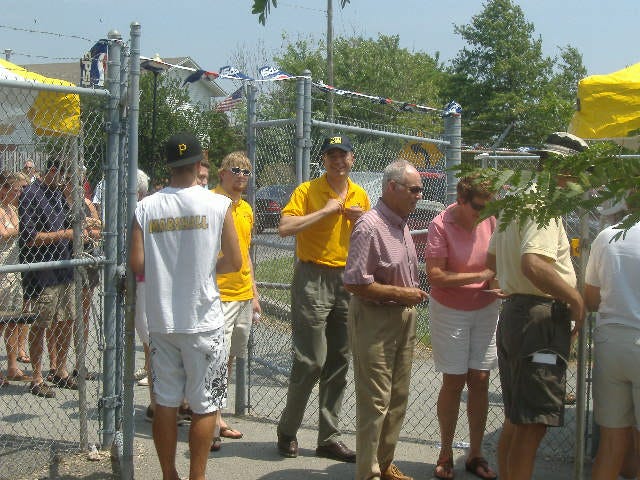 GOP candidate Dr. Andrew Harris (center, in baseball cap) is a little late but none the worse for wear. GOP candidate Dr. Andrew Harris (center, in baseball cap) is a little late but none the worse for wear.