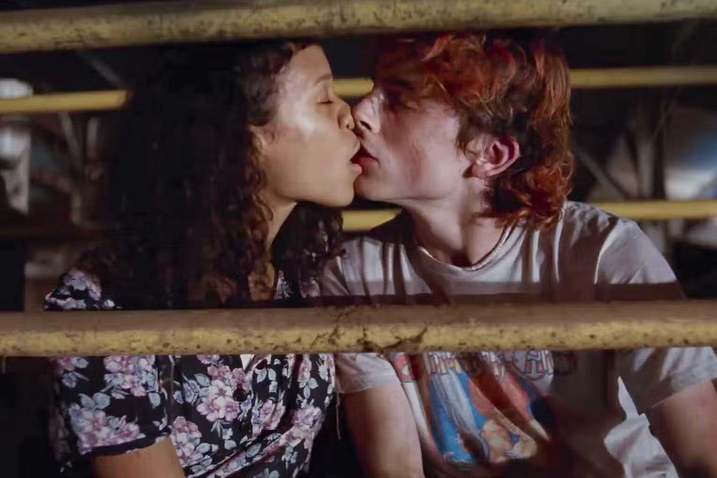 Taylor Russell and Timothée Chalamet as Maren and Lee kissing in Bones and All.