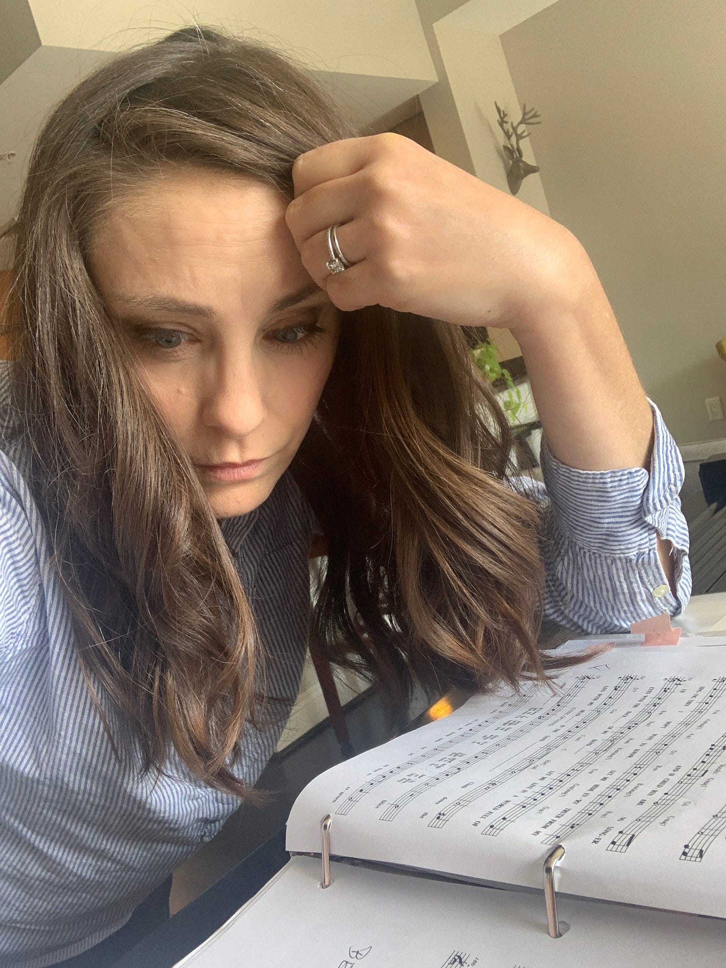 Susan staring at sheet music.