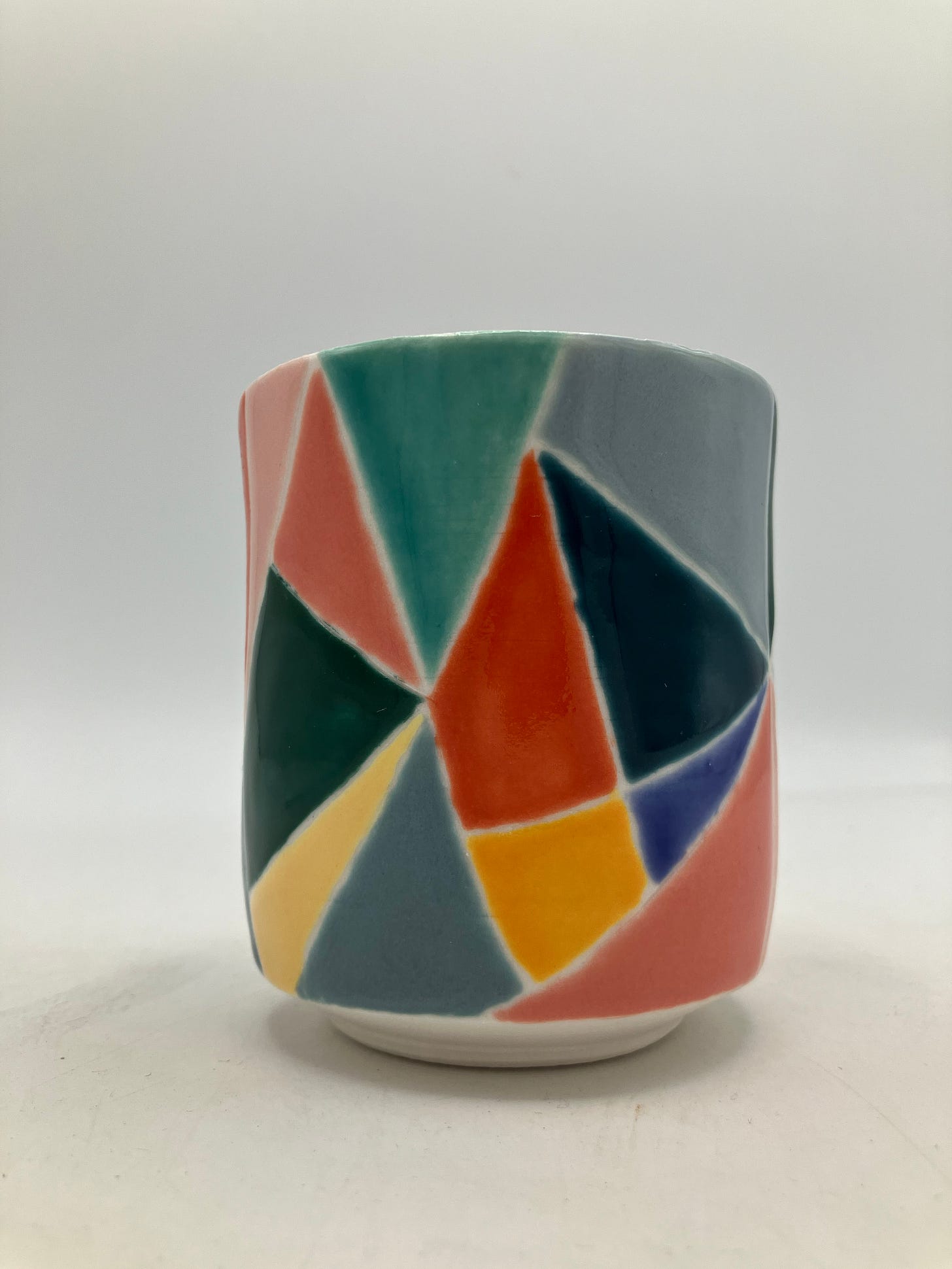 colorful porcelain yunomi in lightbox