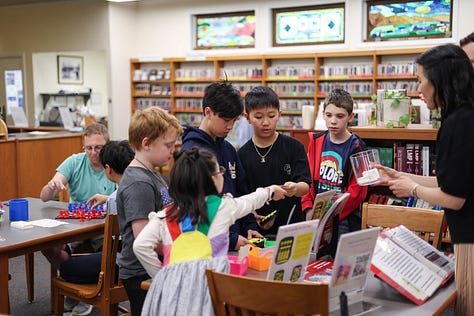 Nine square images from STEM Day, including two students 3d designing, a student sharing his Mars Rover Scratch game, a little kid building with MOLA kit, 3D-Click activities, Tiny robots!, Exploring resources