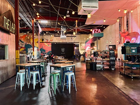 signs, lights, tables, chairs, sky