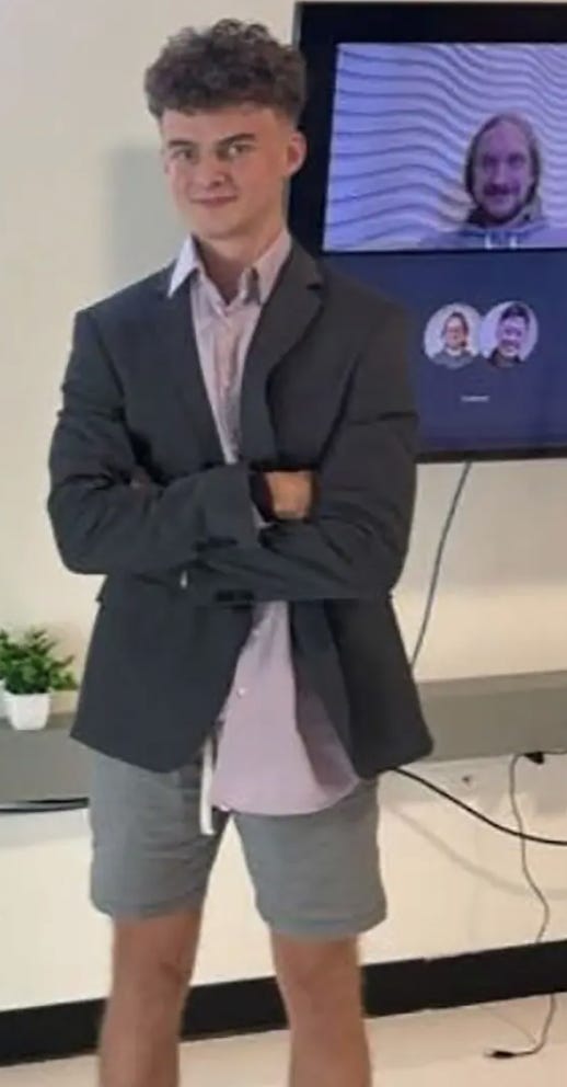 A person in a suit with his arms crossed

AI-generated content may be incorrect.