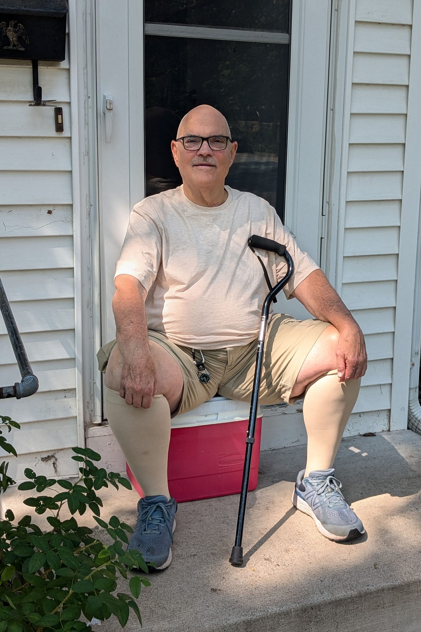 Donald Hammen, an 80 year old man, sits on the front steps to his house. Donald Hammen, an 80 year old man, sits on the front steps to his house.