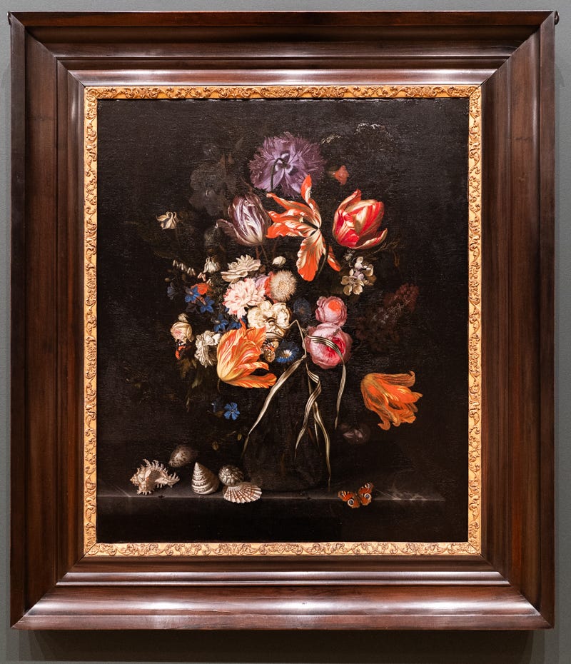 A painting of brightly colored flowers against a black background