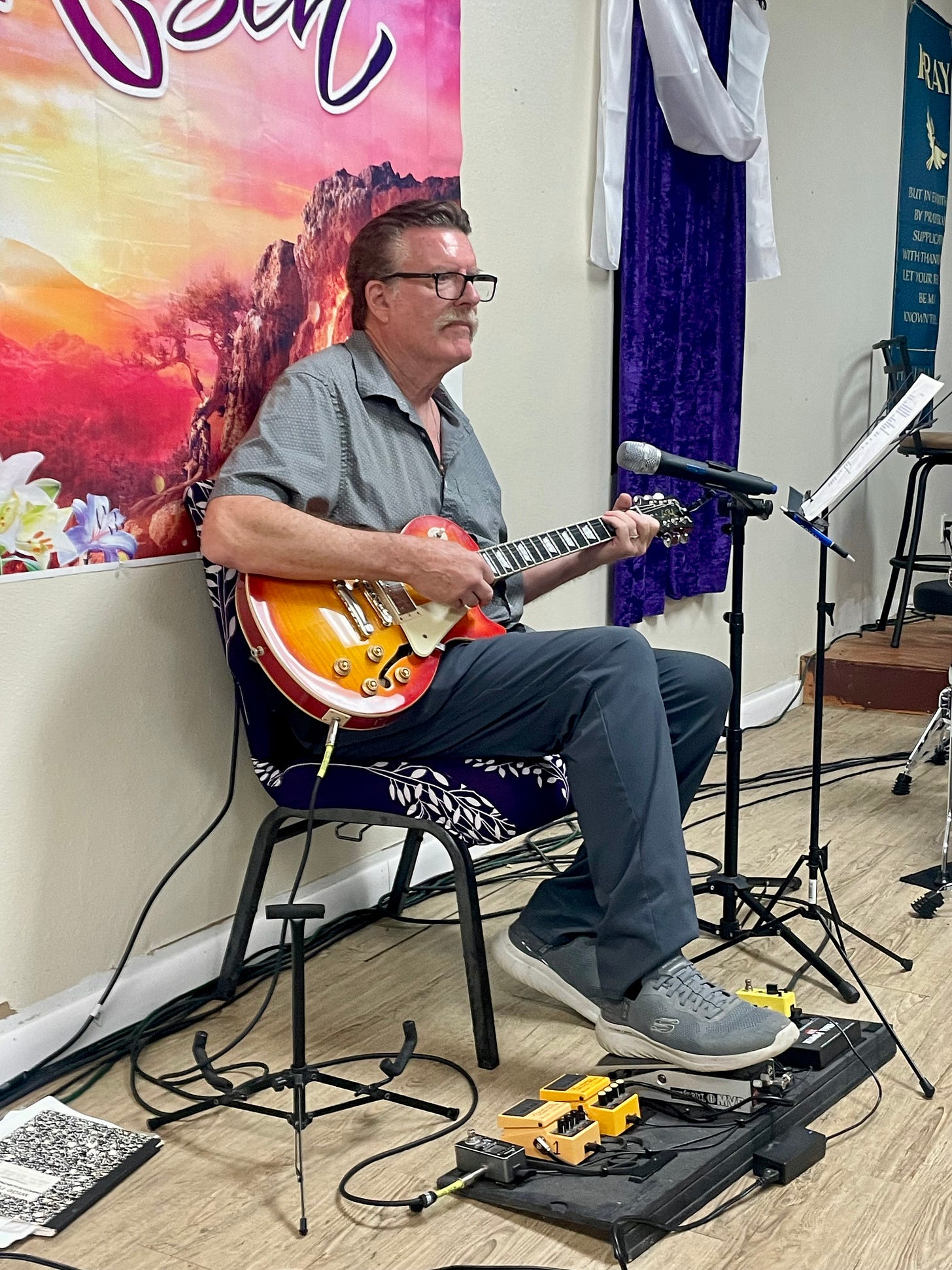 My picture of my husband Tommy playing his guitar at church.
