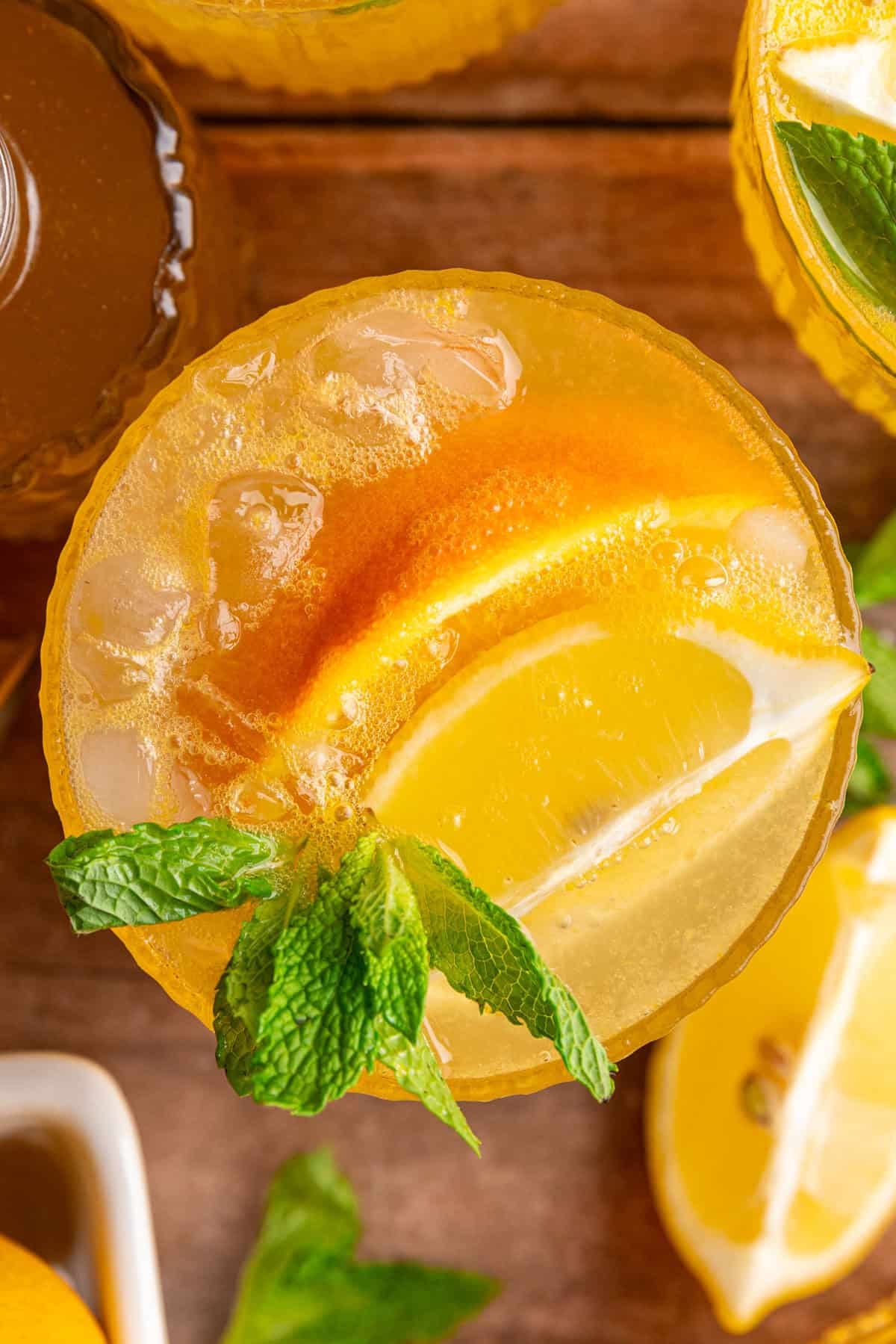A top down view of the orange, lemon, and mint garnishes of a citrus mocktail.