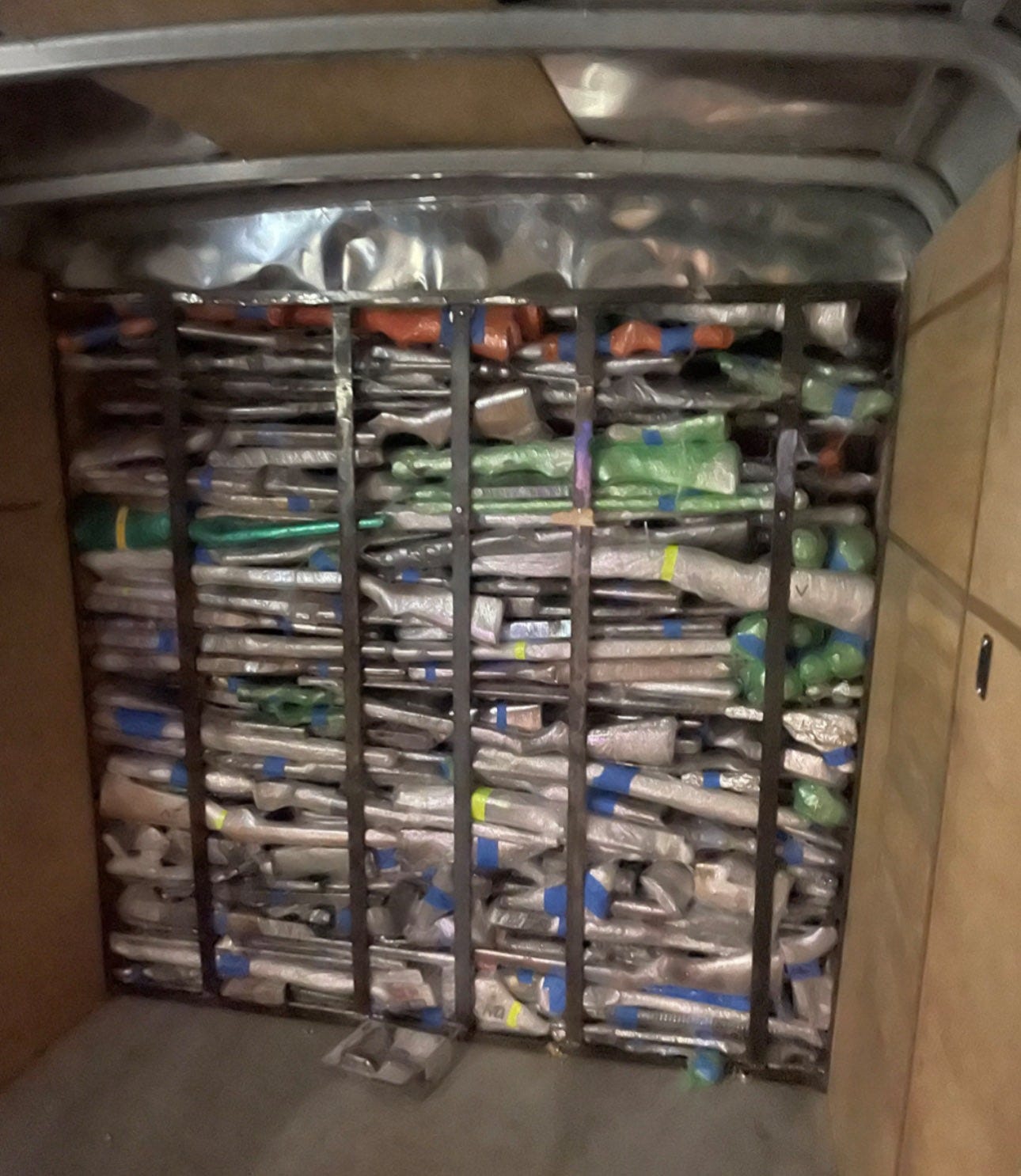 US Customs & Border Protection officers discovered a huge cache of guns and ammo behind false walls of two trailers being towed into Mexico through Laredo, Texas.