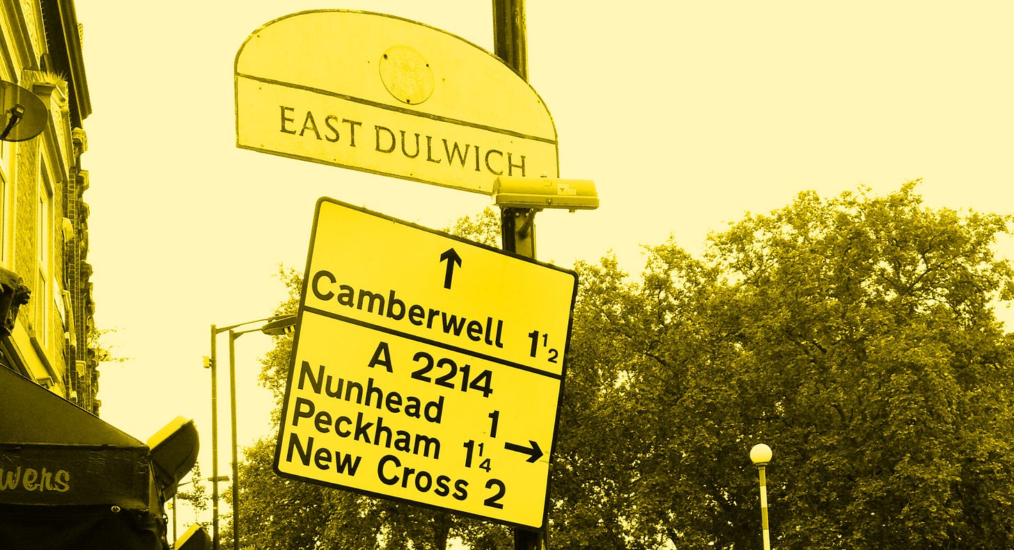 Colourised photograph of a badly mounted direction sign, hanging on to its post at a rakish angle. It points the way to Camberwell, Nunhead, Peckham and New Cross. Above is a much older semi-circular sign reading EAST DULWICH. Colourised photograph of a badly mounted direction sign, hanging on to its post at a rakish angle. It points the way to Camberwell, Nunhead, Peckham and New Cross. Above is a much older semi-circular sign reading EAST DULWICH.