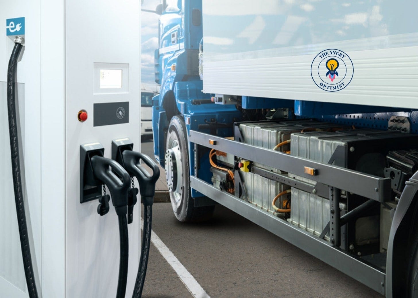 An electric truck at a charging station An electric truck at a charging station