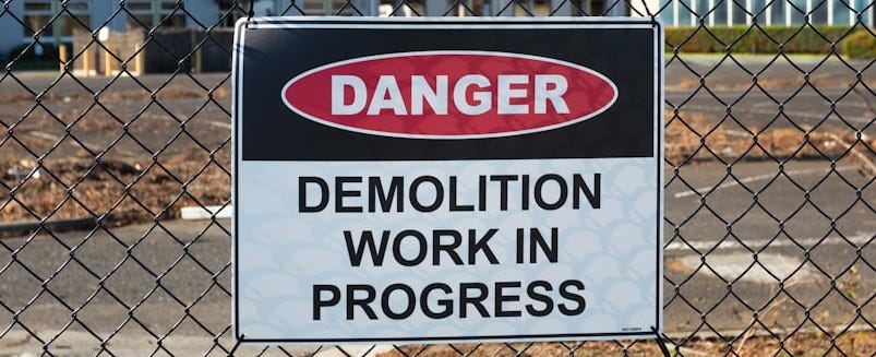 Danger sign for demolition work in progress.