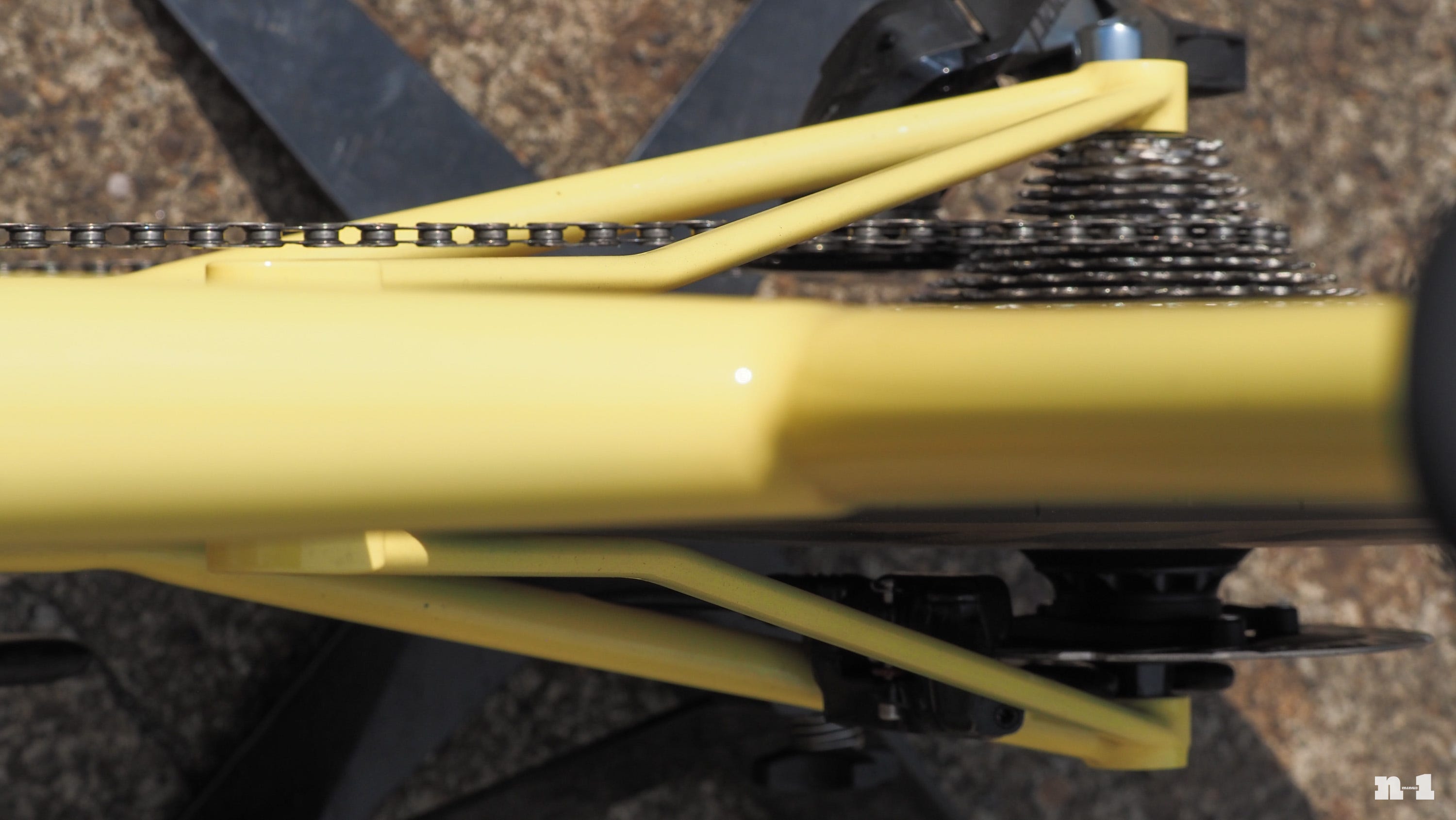 English Cycles yellow time trial bike seatstay bend