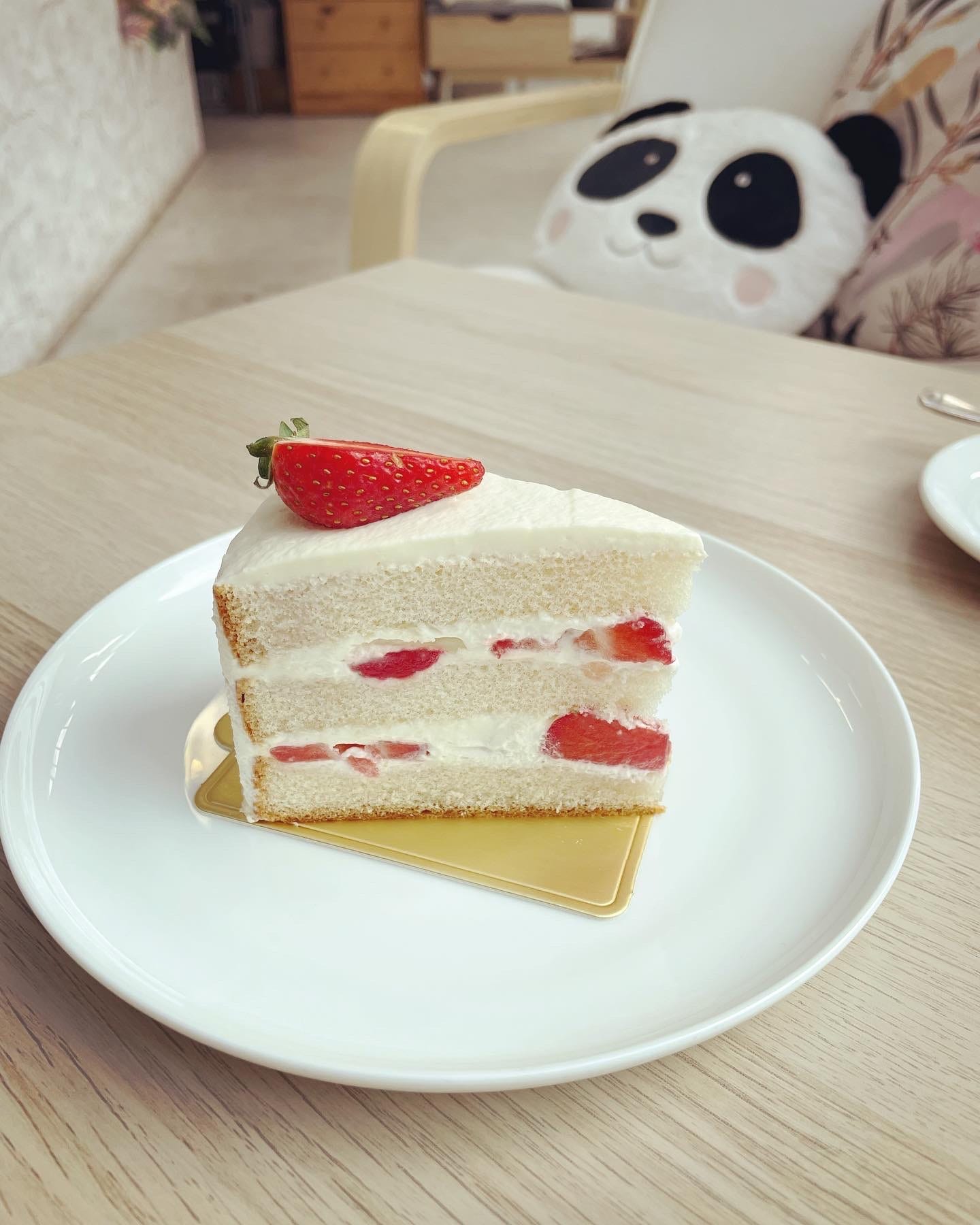 A slice of strawberry sponge cake