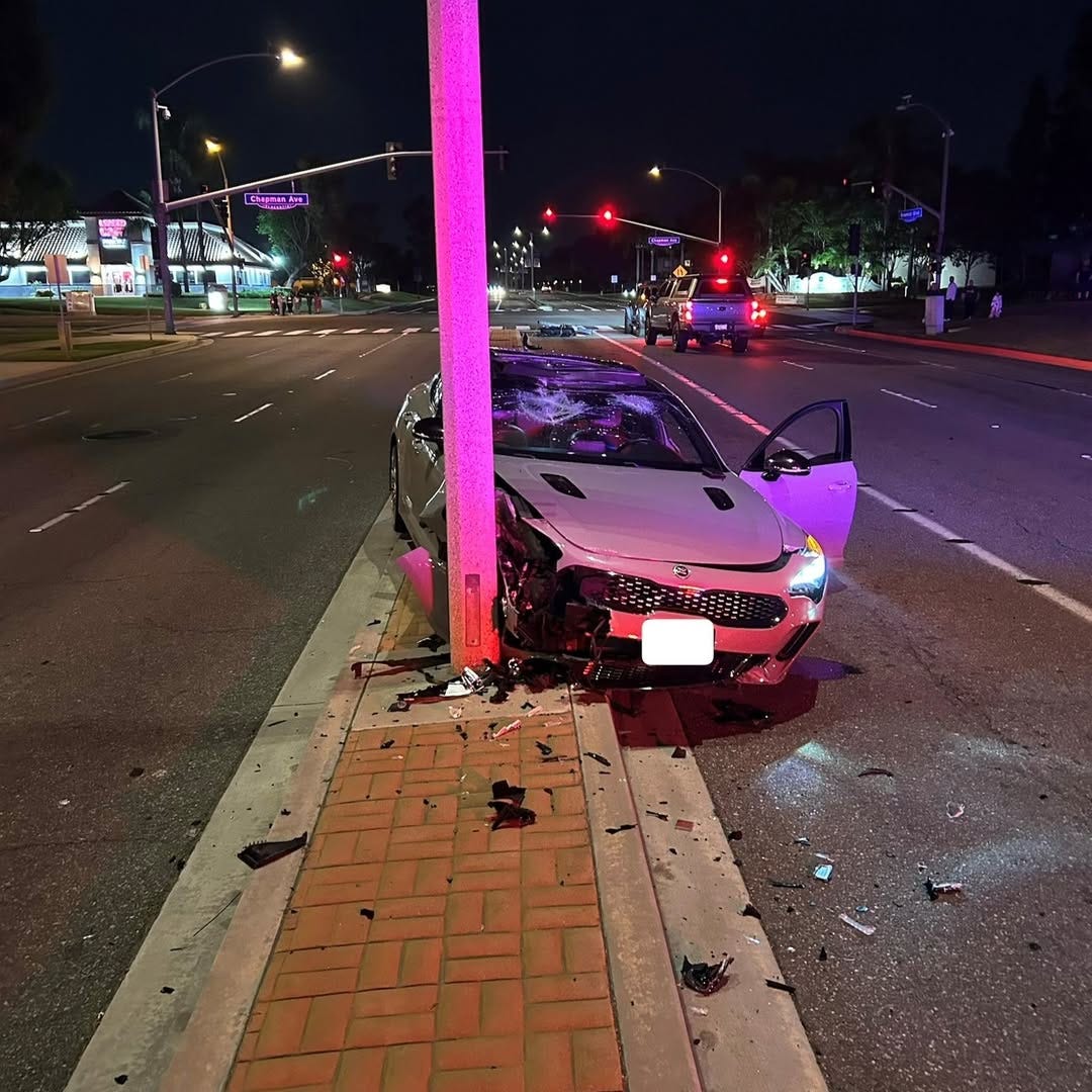 May be an image of car, road and text