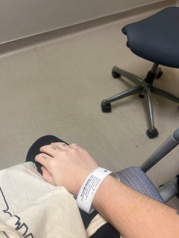 The first photo shows Somer Love wearing a mask and showing off their vaccine shot bandaids. The second photo is Somer in the hospital, showing their hospital bracelet. 