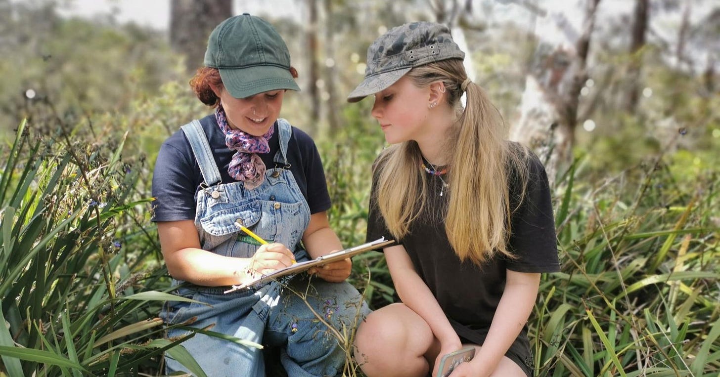 Amelie Vanderstock and Ember Henninger doing a Wild Pollinator Count.