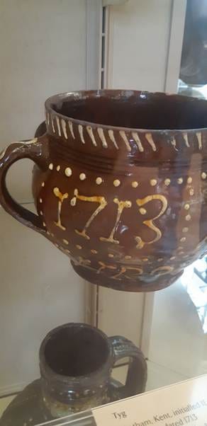 A brown ceramic pot with gold letters
AI-generated content may be incorrect. A brown ceramic pot with gold letters
AI-generated content may be incorrect.