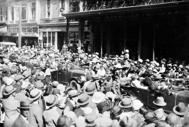 A crowd of people in a street

Description automatically generated