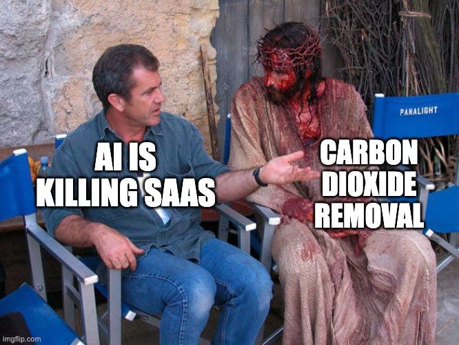 Mel Gibson sitting beside a bloodied actor in Jesus costume on a film set. Gibson is labelled "AI is killing SaaS" and the Jesus figure is labelled "Carbon dioxide removal."