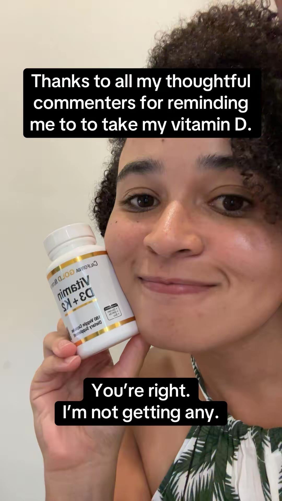 a picture of me smiling, holding a bottle of Vitamin D supplements, and thanking my "thoughtful" commenters for reminding me to take it because I'm not "getting any."