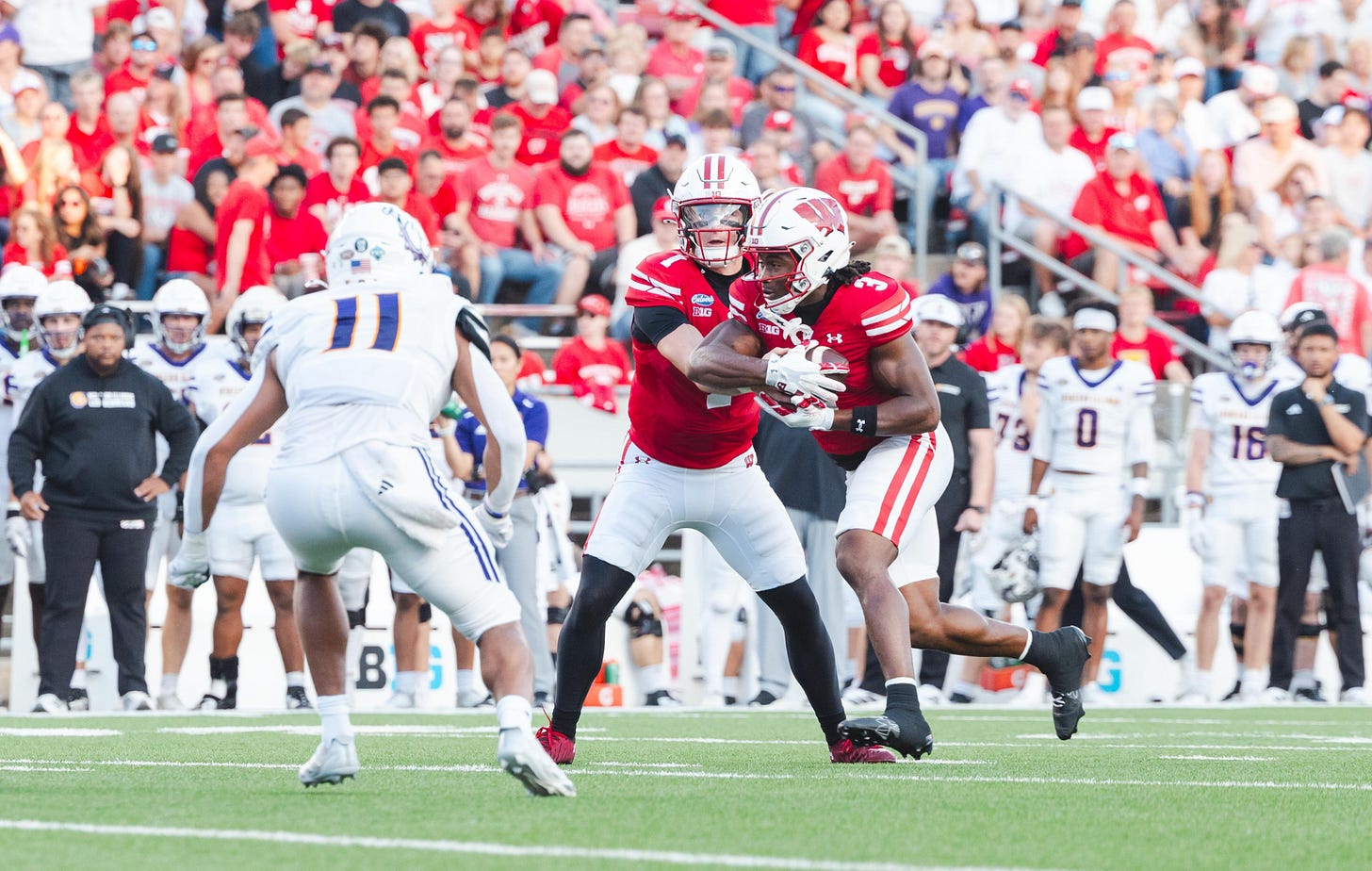 Wisconsin Badgers quarterback Colten Joseph reads a defender with Abu Sama III beside him on a read-option play against Western Illinois. Wisconsin Badgers quarterback Colten Joseph reads a defender with Abu Sama III beside him on a read-option play against Western Illinois.
