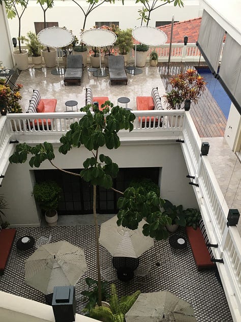 Rooftop pool, interior courtyard from top floor, detail of lobby tile.