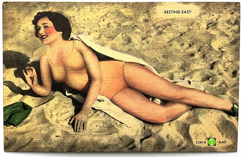 Vintage postcard of bathing beauty 'resting easy'