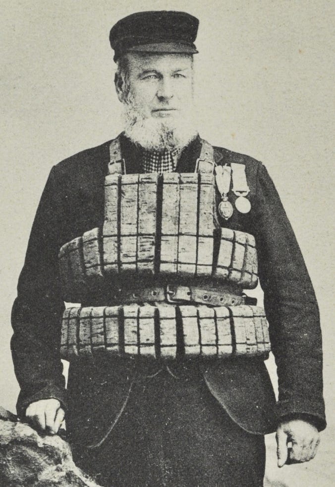 Henry Hood, Coxswain of the Seaton Carew Lifeboat, photographed after his retirement, wearing an RNLI cork life-jacket. The photograph clearly illustrates the small blocks of cork, sewn together and held tight against the body with a leather belt. Henry Hood, Coxswain of the Seaton Carew Lifeboat, photographed after his retirement, wearing an RNLI cork life-jacket. The photograph clearly illustrates the small blocks of cork, sewn together and held tight against the body with a leather belt.