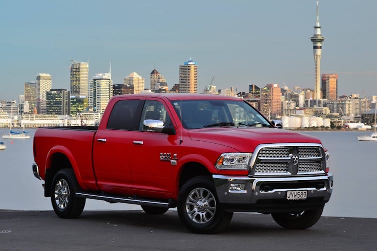 Fancy ute oparked in front of city skyline