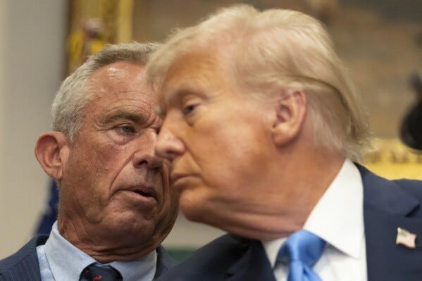 Health and Human Services Secretary Robert F. Kennedy Jr., speaks as President Donald Trump listens in the Roosevelt Room of the White House, Monday, Sept. 22, 2025, in Washington. (AP Photo/Mark Schiefelbein)