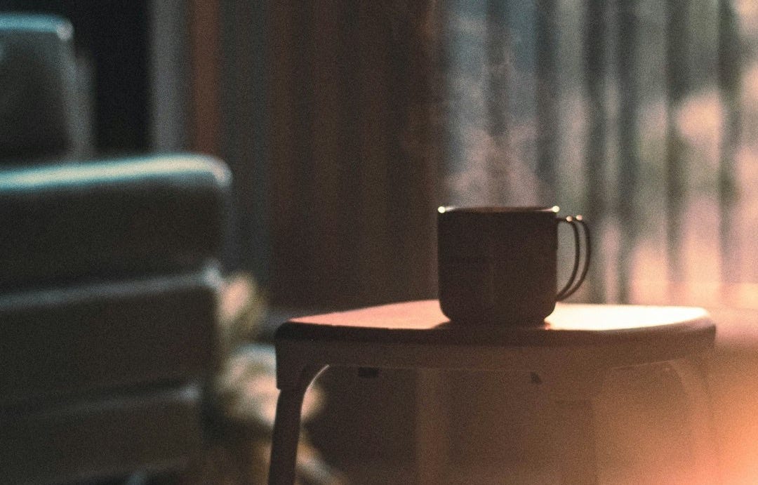 a coffee cup sitting on top of a table