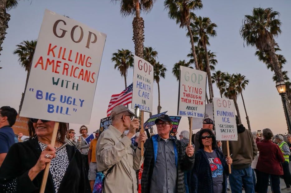 A group of people holding signs

AI-generated content may be incorrect.