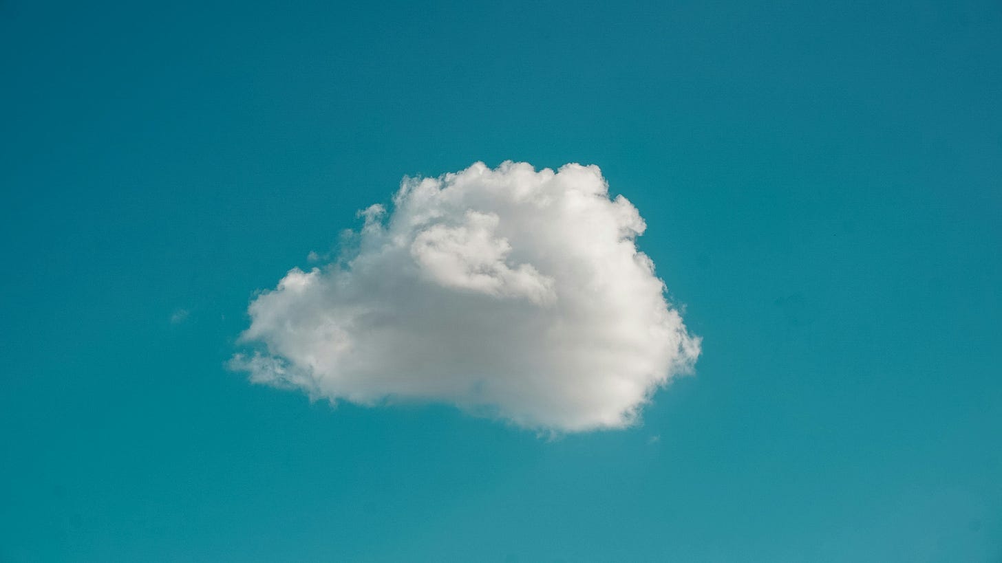a cloud in clear blue sky