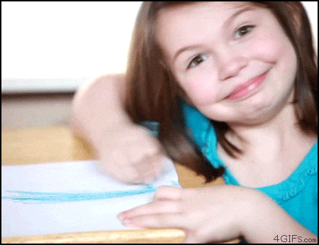 a gif of a young child starring directly at the camera with a big smile coloring quickly back and forth on a paper