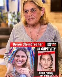 AJC - American Jewish Committee - Doron Steinbrecher, a 30-year-old  veterinary nurse, was kidnapped from her home in Kibbutz Kfar Aza on Oct.  7. She kept in touch with her sister and