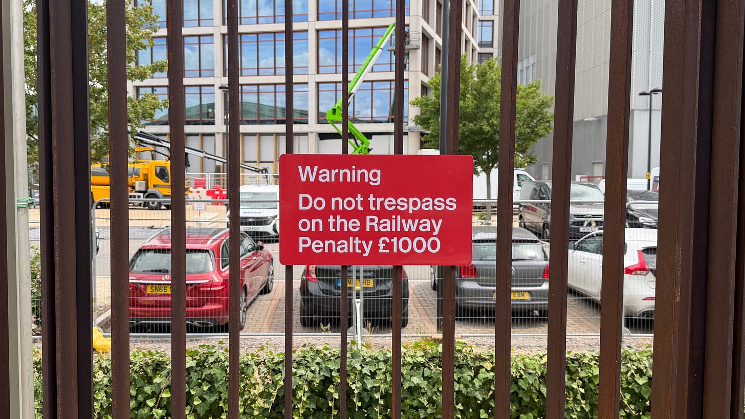 Photo of a sign in Rail Alphabet warning against railway trespass.