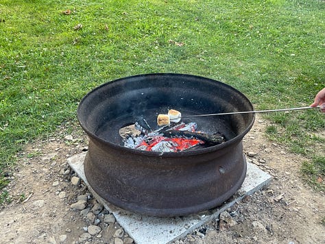 A blackstone griddle, cooking various meals, and a fire ring with marshmallows and a chocolate center