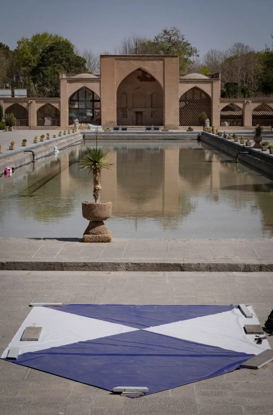 Blue-and-white shield signs, officially known as the Blue Shield, are installed outside the historic Chehel Sotoun Palace in Isfahan, Iran, on March 11, 2026.