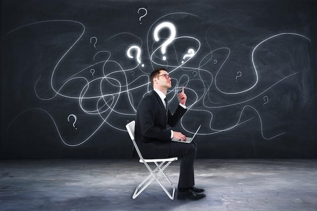 Premium Photo | Young european businessman with laptop sitting on chair ...