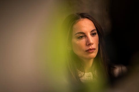 a woman looks ahead