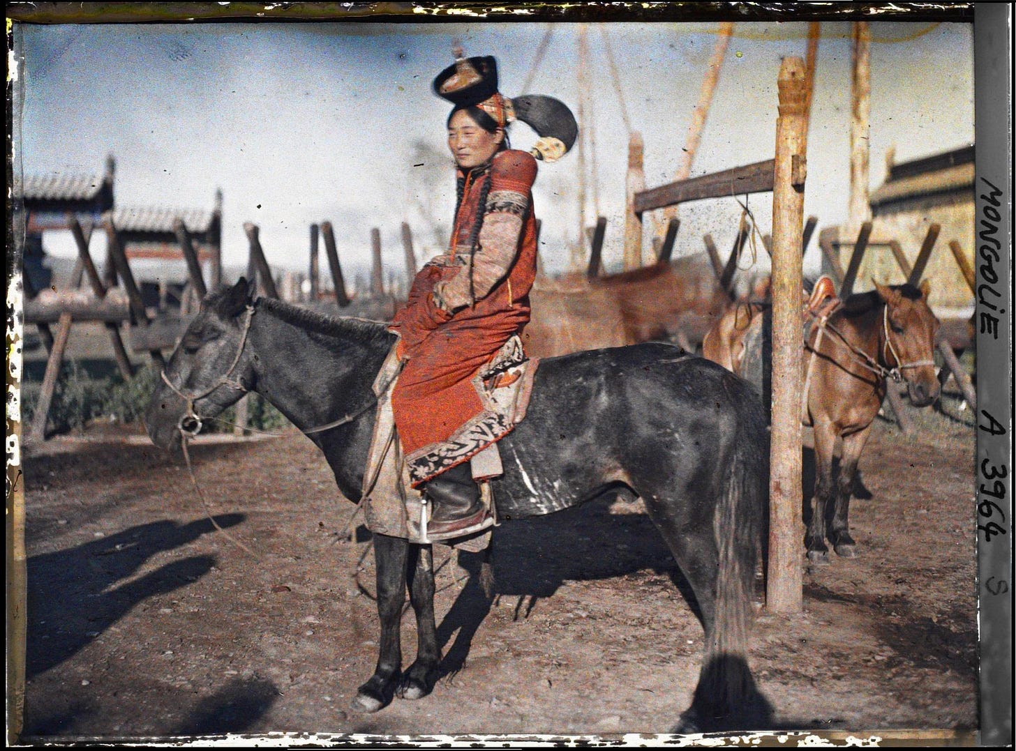 A Mongolian bride in traditional attire on her horse, captured in an autochrome photograph on July 24, 1913. A Mongolian bride in traditional attire on her horse, captured in an autochrome photograph on July 24, 1913.