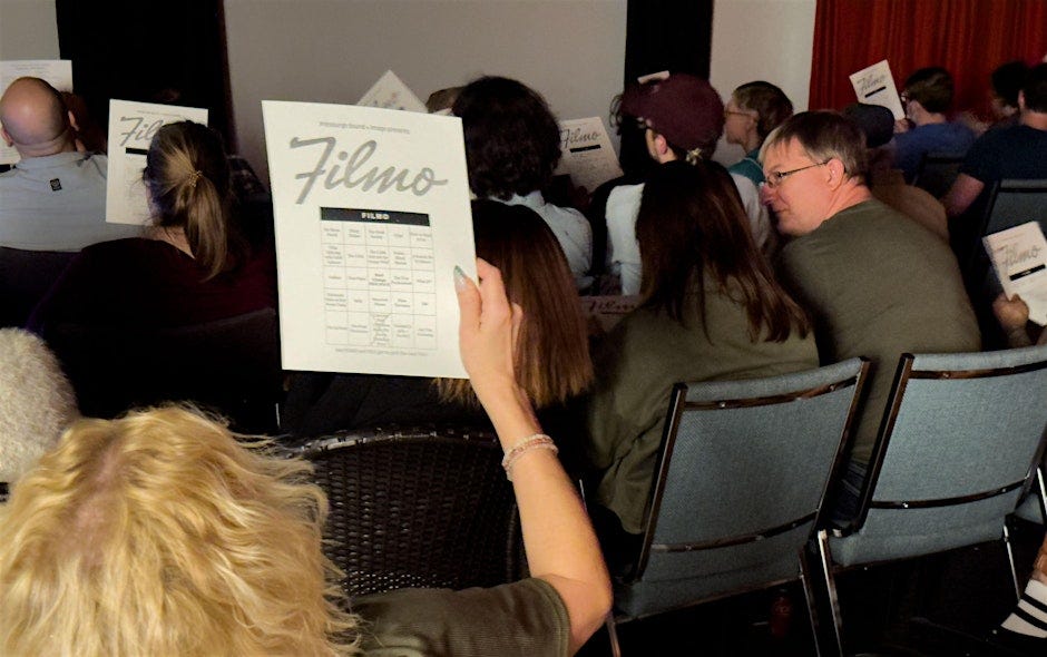 an audience full of FILMO card holders