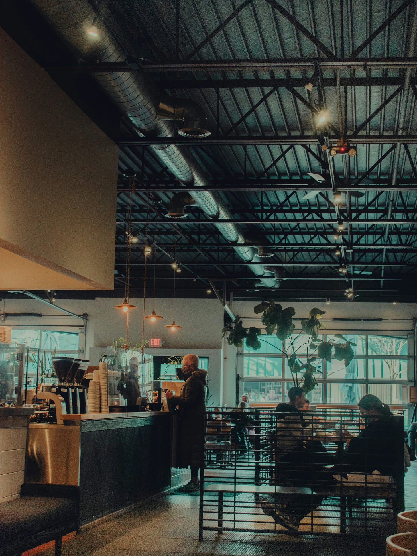 Customers and baristas interact inside a specialty café, illustrating how cafés in Southeast Asia have become places for work, socializing, and cultural experiences as the region's coffee culture continues to grow. Customers and baristas interact inside a specialty café, illustrating how cafés in Southeast Asia have become places for work, socializing, and cultural experiences as the region's coffee culture continues to grow.