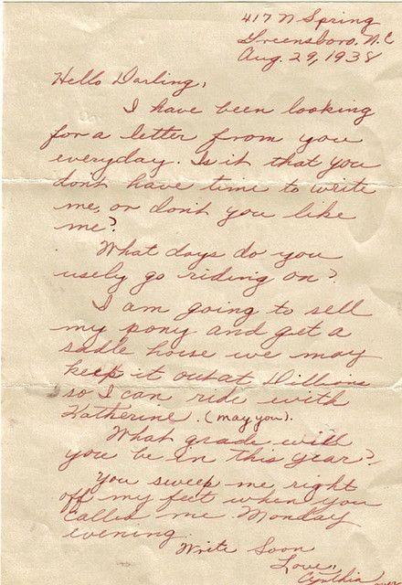 This may contain: an old handwritten letter with red writing on it's side and the words written in cursive handwriting