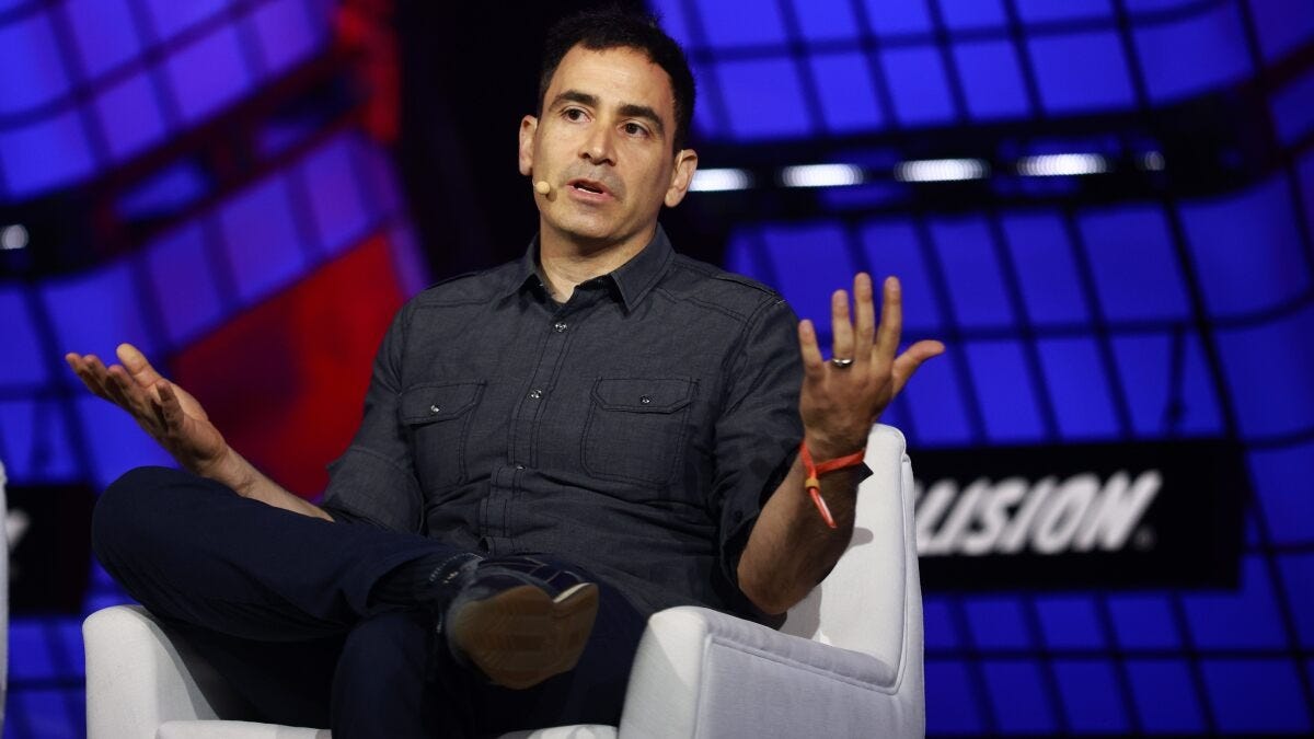 Elad Gil speaking on stage at a technology conference, discussing startups, investing, and innovation