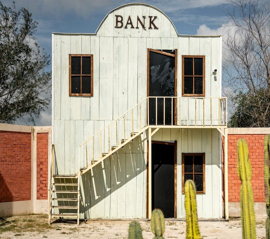 An old bank sits in the desert.
