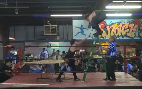 [Screenshot: McFinnegan on ladder, Doepp attacking]