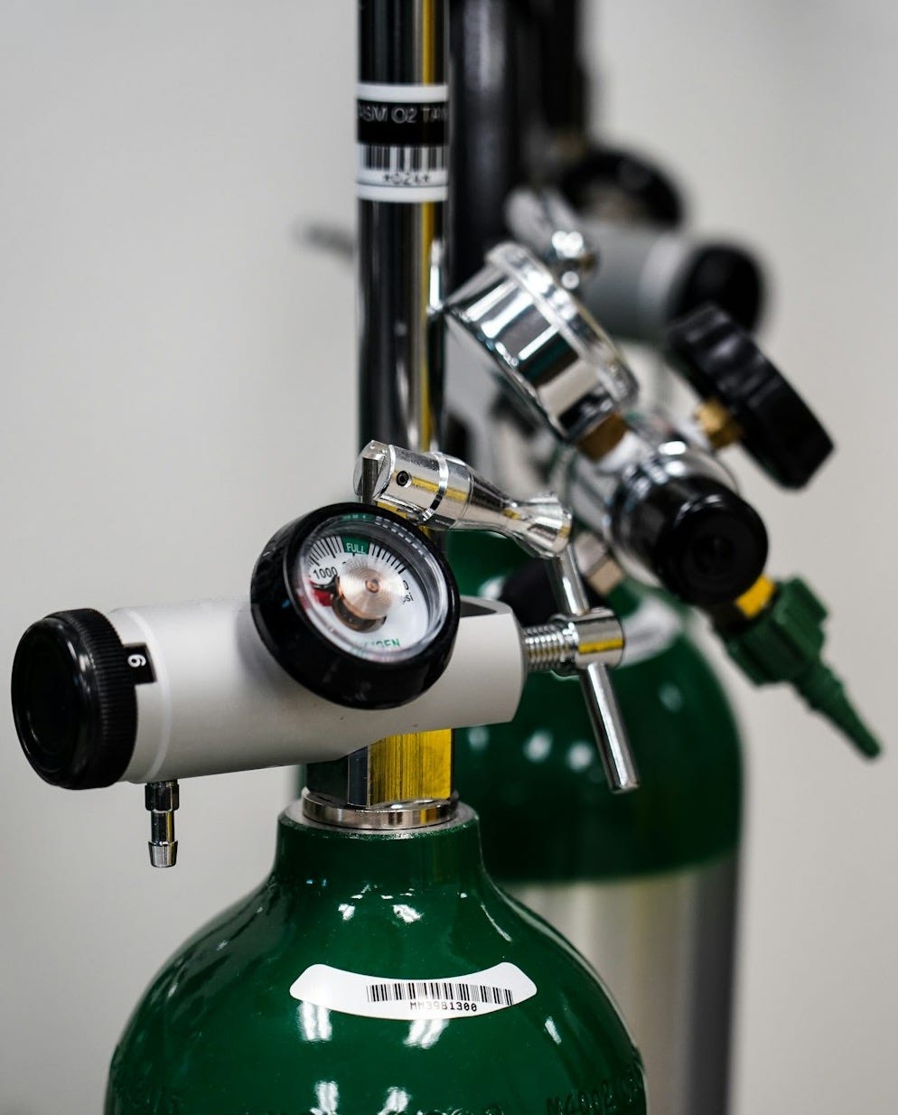 green and silver bottle opener